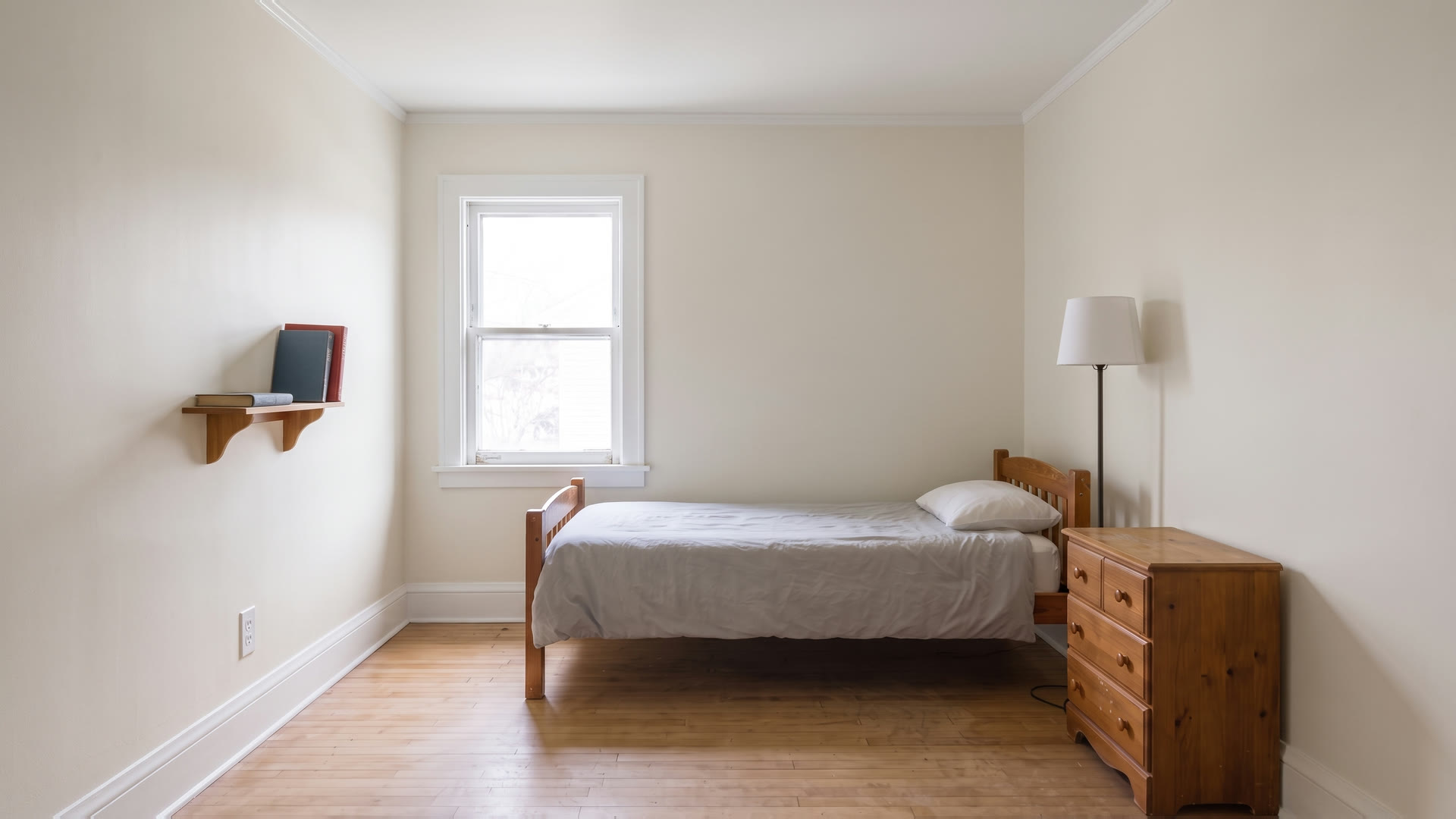 The same child’s bedroom freshly painted: smooth walls, a crisp white ceiling, and clean white trim.